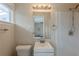 Bathroom with a shower, toilet, and vanity with framed mirror at 2919 Alameda Trl, Decatur, GA 30034