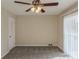 Cozy bedroom with carpet, ceiling fan, and sliding glass doors at 2919 Alameda Trl, Decatur, GA 30034