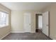 Bedroom with carpet flooring, a window and two closets at 2919 Alameda Trl, Decatur, GA 30034