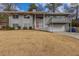 Inviting two-story home features a well-manicured lawn and neutral paint scheme at 2919 Alameda Trl, Decatur, GA 30034