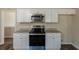 This kitchen features granite countertops, white cabinets, and modern stainless steel appliances at 2919 Alameda Trl, Decatur, GA 30034