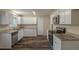 The remodeled kitchen has new stainless steel appliances, granite counters and hardwood flooring at 2919 Alameda Trl, Decatur, GA 30034