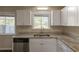 Bright kitchen features granite countertops, stainless appliances and white cabinets at 2919 Alameda Trl, Decatur, GA 30034