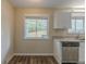 Bright kitchen features granite countertops and white cabinets at 2919 Alameda Trl, Decatur, GA 30034