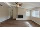 Living room features wood-look floors, painted brick fireplace, and large windows at 2919 Alameda Trl, Decatur, GA 30034