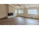 Living room with vaulted ceiling, brick fireplace, and multiple windows at 2919 Alameda Trl, Decatur, GA 30034