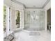 Spa-like bathroom with large walk-in shower and marble floors at 70 Finch Forest Trl, Atlanta, GA 30327