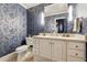Bathroom with blue patterned walls and white vanity at 70 Finch Forest Trl, Atlanta, GA 30327