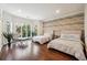 Bedroom with two twin beds, wood floors, and large windows at 70 Finch Forest Trl, Atlanta, GA 30327