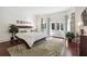 Serene bedroom with hardwood floors and French doors at 70 Finch Forest Trl, Atlanta, GA 30327