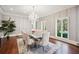 Elegant dining room with hardwood floors, large windows, and a marble table at 70 Finch Forest Trl, Atlanta, GA 30327