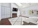 Relaxing Gathering room with built-in cabinets, fireplace, and hardwood floors at 70 Finch Forest Trl, Atlanta, GA 30327