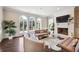 Gathering room boasts a white brick fireplace and arched windows at 70 Finch Forest Trl, Atlanta, GA 30327
