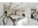 Open kitchen with breakfast bar, white cabinetry, and breakfast area at 70 Finch Forest Trl, Atlanta, GA 30327