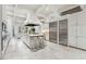 Spacious kitchen with island, stainless steel appliances, and white cabinetry at 70 Finch Forest Trl, Atlanta, GA 30327