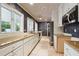 Long galley kitchen with granite counters and white cabinets at 70 Finch Forest Trl, Atlanta, GA 30327