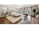 Luxurious main bedroom with hardwood floors and large windows at 70 Finch Forest Trl, Atlanta, GA 30327