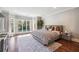 Spacious main bedroom with wood floors, large windows, and a sitting area at 70 Finch Forest Trl, Atlanta, GA 30327