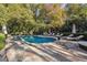 Relaxing freeform pool with ample lounge space at 70 Finch Forest Trl, Atlanta, GA 30327