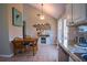 Cozy dining area with table, chairs, and stainless steel appliances in the open kitchen at 1469 Harmony Grove Church Rd, Auburn, GA 30011