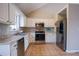 Bright kitchen featuring stainless steel appliances, white cabinets, and granite countertops at 1469 Harmony Grove Church Rd, Auburn, GA 30011
