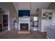 Open living room featuring a fireplace, TV, and views into the kitchen and bedroom at 1469 Harmony Grove Church Rd, Auburn, GA 30011