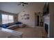 Bright living room featuring vaulted ceilings, a fireplace, and a comfortable sectional sofa at 1469 Harmony Grove Church Rd, Auburn, GA 30011