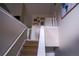 Bright staircase featuring neutral walls, white trim, and a safety gate at 1469 Harmony Grove Church Rd, Auburn, GA 30011