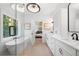 Luxurious bathroom with soaking tub, double vanity, and glass shower at 1211 Stephens Se St, Smyrna, GA 30080
