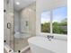 Spa-like bathroom with soaking tub and walk-in shower at 1211 Stephens Se St, Smyrna, GA 30080