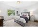 Cozy bedroom with plush carpeting and large window at 1211 Stephens Se St, Smyrna, GA 30080