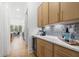 Butler's pantry with quartz countertops, custom cabinetry, and wine cooler at 1211 Stephens Se St, Smyrna, GA 30080