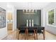 Bright dining room features a statement wall and modern chandelier at 1211 Stephens Se St, Smyrna, GA 30080