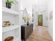 Bright entryway with built-in shelving and a modern console table at 1211 Stephens Se St, Smyrna, GA 30080