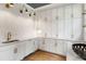 Bright laundry room with white cabinets and modern fixtures at 1211 Stephens Se St, Smyrna, GA 30080