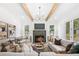 Bright living room with hardwood floors, fireplace, and large windows at 1211 Stephens Se St, Smyrna, GA 30080