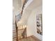 Elegant staircase with wood railings and a unique light fixture at 1211 Stephens Se St, Smyrna, GA 30080
