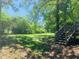 Spacious backyard with lush lawn and large trees at 158 Scarsdale Dr, Riverdale, GA 30274
