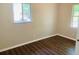 Spacious bedroom featuring wood-look floors and a window at 158 Scarsdale Dr, Riverdale, GA 30274