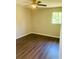 Well-lit bedroom, offering wood-look floors and a ceiling fan at 158 Scarsdale Dr, Riverdale, GA 30274