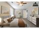 Staged main bedroom featuring neutral tones, soft carpet, and tasteful decor at 1715 Rolling Stone Dr, Lithonia, GA 30058