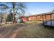 Expansive backyard with mature trees and a storage shed at 6625 Imperial Dr, Morrow, GA 30260