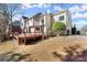 Exterior of the house with a red wooden deck and a lawn at 8140 High Hampton Chase, Alpharetta, GA 30022