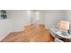 Cozy sitting room with light colored walls, light wood floors, and white couches and table at 8140 High Hampton Chase, Alpharetta, GA 30022