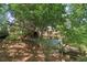 View of backyard showcasing a multi-tiered deck and landscaped area, perfect for outdoor entertaining at 959 Cedar Falls Sw Ct, Lilburn, GA 30047