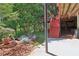 Landscaped backyard with garden and patio area, offering a peaceful outdoor retreat at 959 Cedar Falls Sw Ct, Lilburn, GA 30047