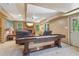 Finished basement featuring a shuffleboard table and wall-mounted television over a fireplace at 959 Cedar Falls Sw Ct, Lilburn, GA 30047