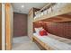 Basement bedroom featuring built-in bunk beds, carpet, and closet at 959 Cedar Falls Sw Ct, Lilburn, GA 30047