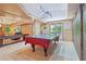 Basement ping pong table in front of brick accent wall and patio doors at 959 Cedar Falls Sw Ct, Lilburn, GA 30047