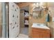 Charming bathroom with a decorative mirror and a view into a bunk room at 959 Cedar Falls Sw Ct, Lilburn, GA 30047